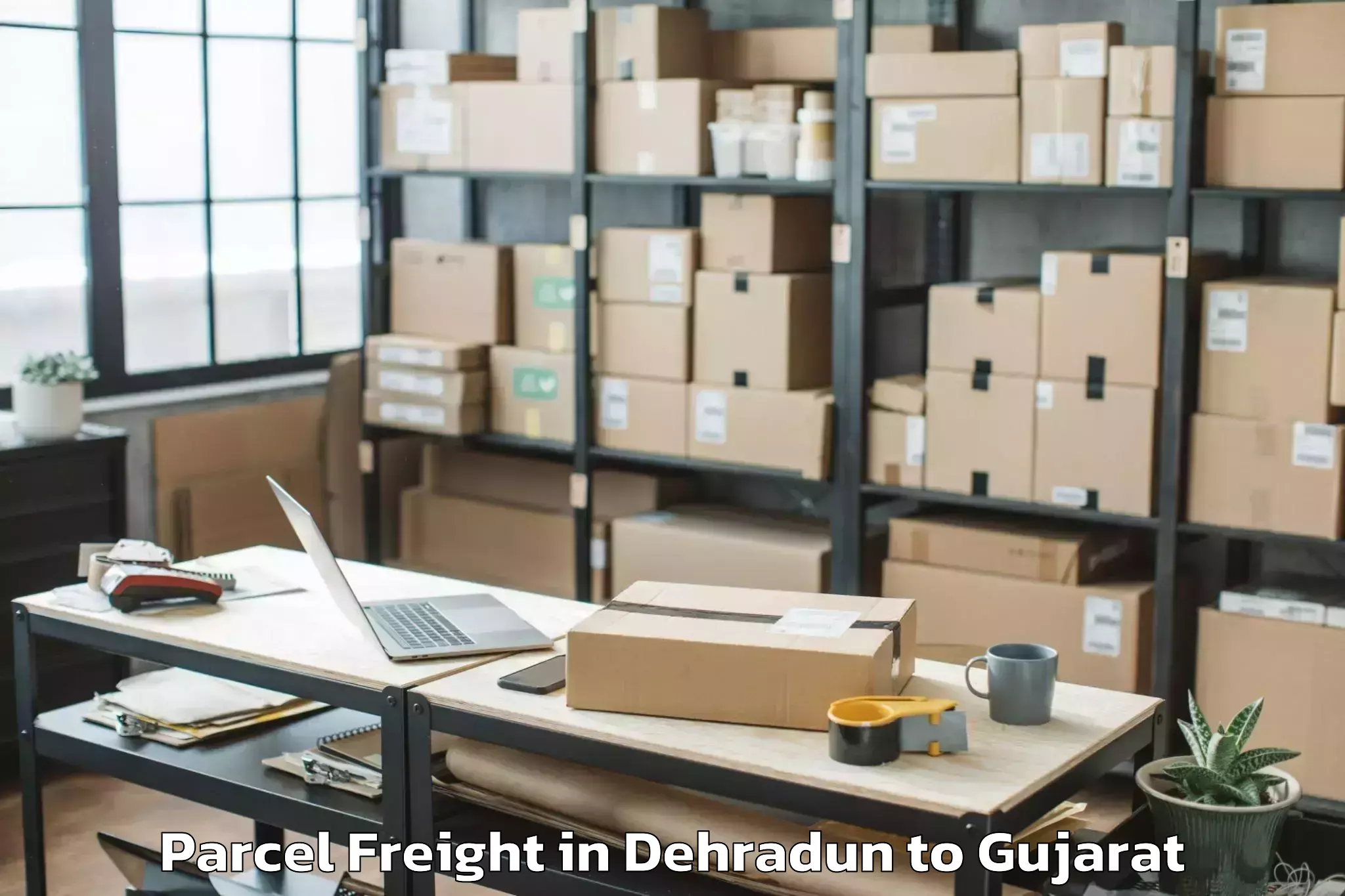 Top Dehradun to Vadgam Parcel Freight Available